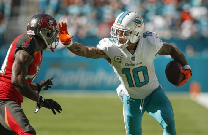 Miami Dolphins wide receiver Kenny Stills (10) stiff arms Tampa Bay cornerback Ryan Smith (29). Mandatory Credit: Reinhold Matay-USA TODAY